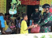 Berbagi Makan Siang Gratis, Satgas Yonif 122/TS Laksanakan Kegiatan Jumat Berkah di Kampung Ampas Papua