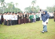 Diguyur Hujan, Upacara HSN 2026 Siak Berlangsung Khidmat, Afni: Santri Penjaga Nadi Bangsa